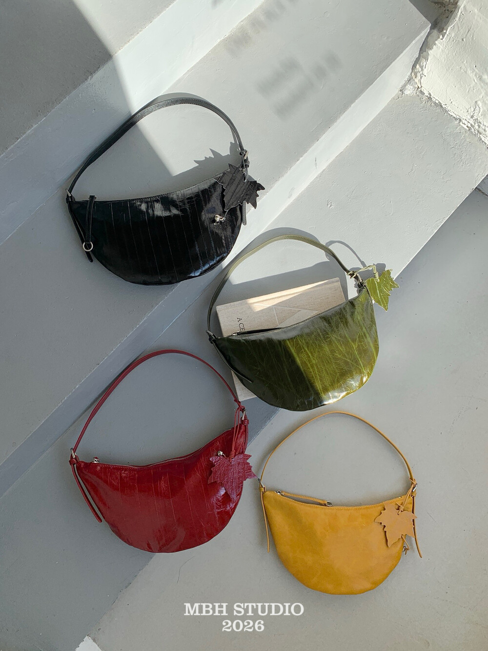 Eel Grain Top Layer Cowhide Crescent Shoulder Bag with Maple Leaf Charm